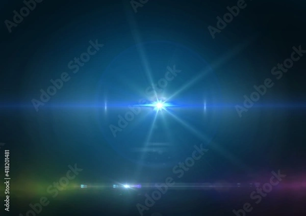 Fototapeta Glowing blue spot of light and light trails on blue background