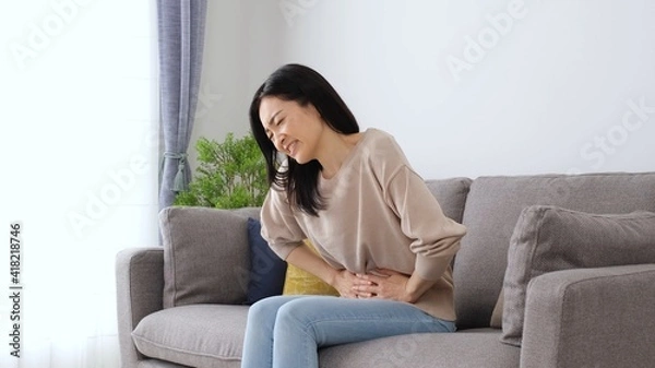 Fototapeta 女性　腹痛