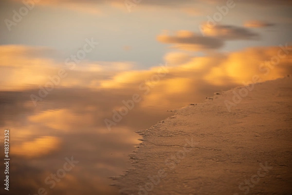 Fototapeta Clouds reflected on water and ice
