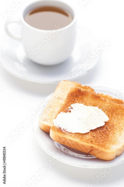Fototapeta tea and toast with butter isolated on white
