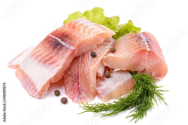 Fototapeta Pangasius fish fillet, pieces on a green lettuce leaf. Isolated on a white background. Fresh Fish Fillet.