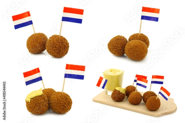 Fototapeta A real traditional Dutch snack called "bitterballen" with a Dutch flag toothpick on a white background
