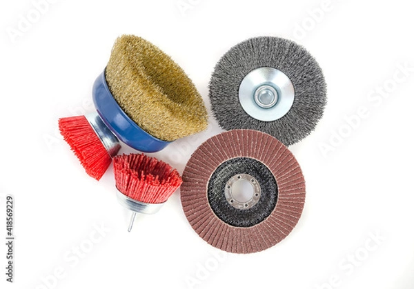 Fototapeta Polishing brushes and grinding discs of an angle grinder isolated on white background