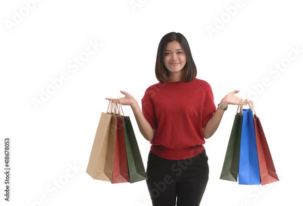 Obraz Young Asian women is shopping happily, on a white background.