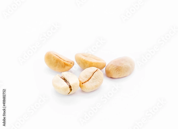 Obraz Several unroasted coffee beans on white background