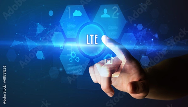 Fototapeta Hand touching LTE inscription, new technology concept