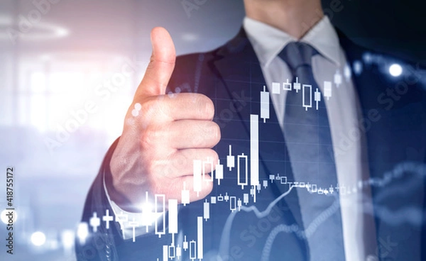 Fototapeta Businessman give a thumb up, double exposure with candlesticks g
