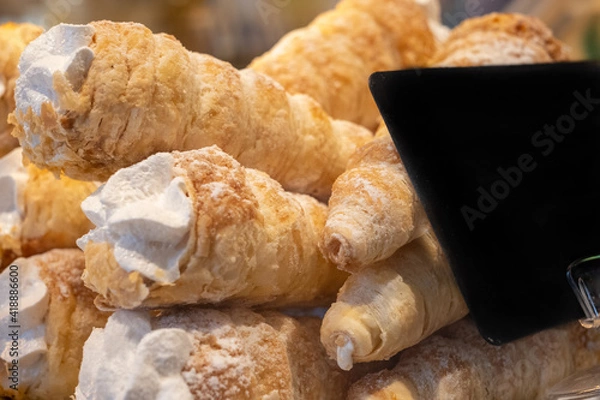 Obraz pastry tubes with cream. Sweet tube with whipped cream. Selective focus.