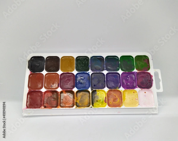 Fototapeta palette of used watercolor paints on white background