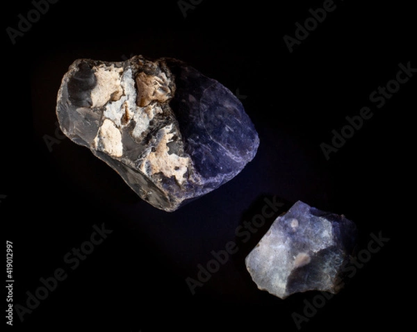 Fototapeta A couple of silicon mineral nuggets from Novy Volkovysk, Belarus. A photo of stones isolated on black. For Geology minerology websites, stone collection catalog, Natural Science museum wall charts