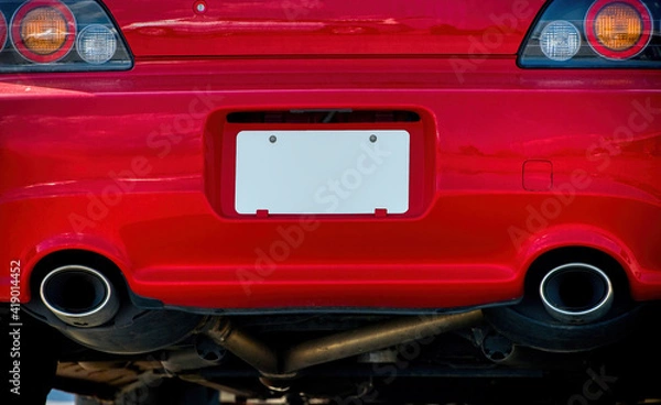 Fototapeta Blank White License Plate On Red Car Bumper REVISED