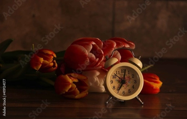 Obraz red tulips with old watch