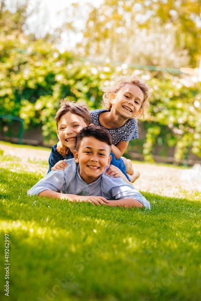 Obraz Portrait of three little children as a tower