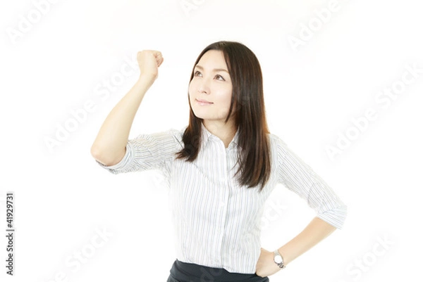 Fototapeta ガッツポーズをして喜ぶオフィスレディー