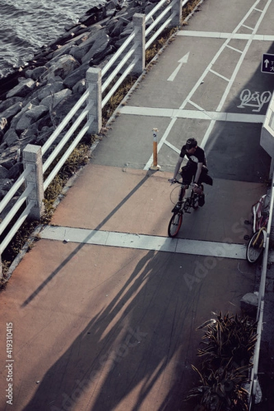 Obraz A cyclist travelling along a bike path in New Territories Hong Kong