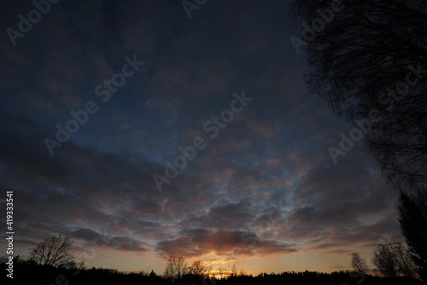 Obraz Evening clouds at sunset 