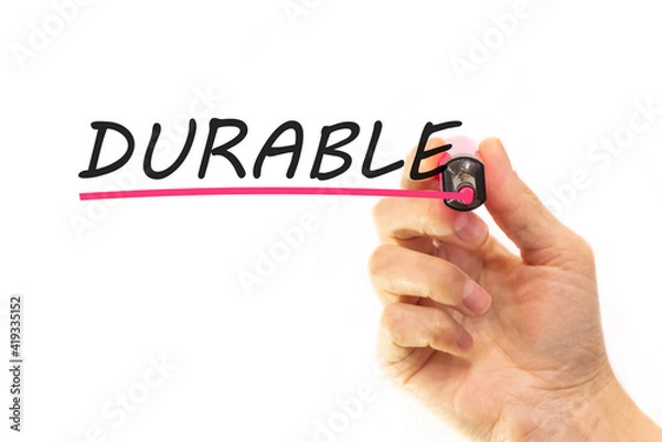 Fototapeta the hand writes the word durable with a marker on a white background. business concept