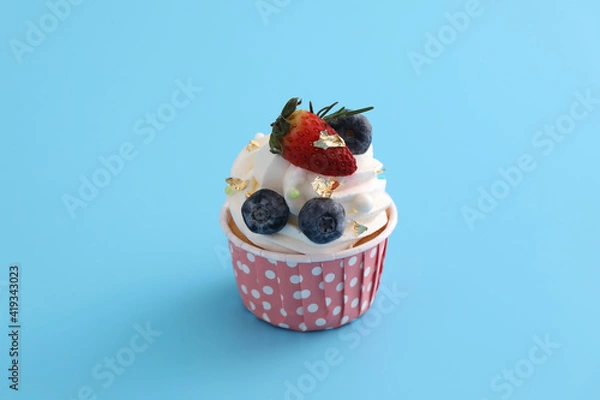 Obraz Fruits cupcake isolated in blue background