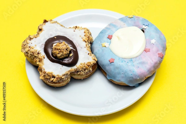 Obraz Various donuts on yellow background