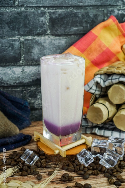Fototapeta Iced Milkshake Taro is combined taro powder, milk, brewed tea, ice, and creamer. taste is sweetness, smooth, an creamy so is perfect drink on tropical area