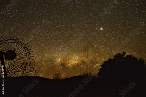 Fototapeta milky way and farm harvester 