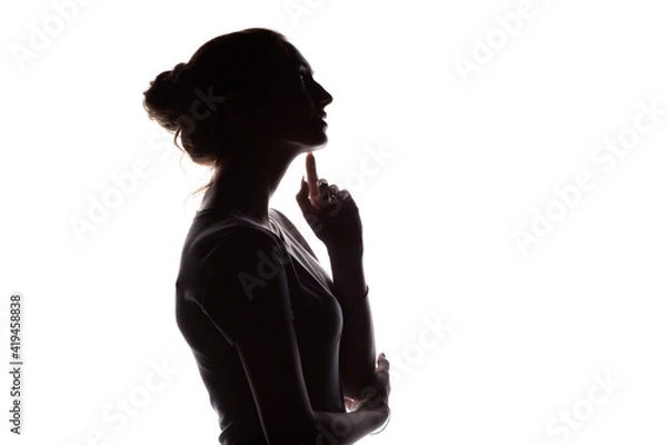 Obraz profile silhouette of pensive girl with hand at the chin, a young woman with hand-picked hair on a white isolated background