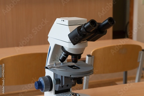 Fototapeta Microscope in the workroom on the table