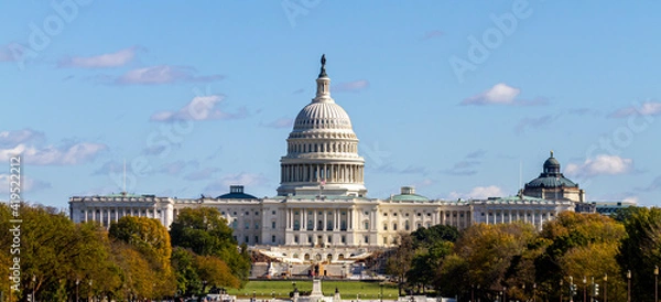 Fototapeta Panoramic image of the US Capitol building in Washington DC as seen from national mall This iconic place holds senate and congress. It is a sunny autumn day and clear sky with a few clouds