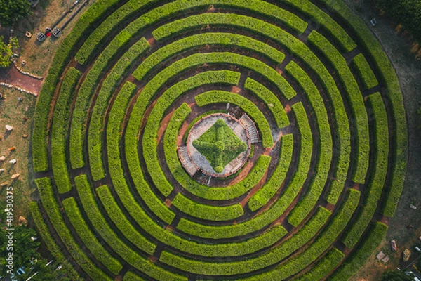 Obraz Aerial view of a circular garden maze and green pavilion