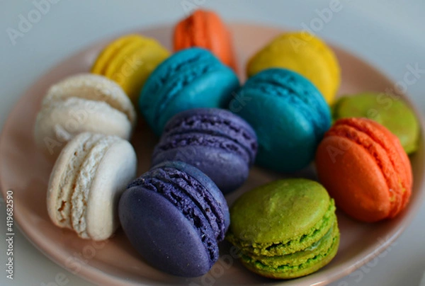 Fototapeta Multicolored macaroons on a plate, close up  