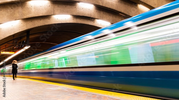 Obraz Long exposure photography of a subway train in motion in a station