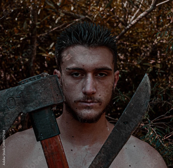 Fototapeta axe in the forest