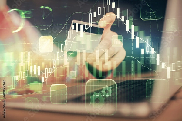 Fototapeta Double exposure of man hands holding a credit card and Forex graph drawing. Stock trading and digital fintech in Internet E-commerce concept.
