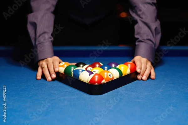 Fototapeta Hands on billiard balls