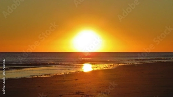 Obraz sunset on the beach with a reflection