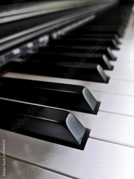 Obraz Soft focus : Close up of piano keys. Side view of a musical instrument.