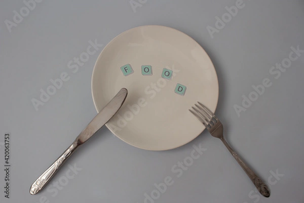 Obraz spoon and fork on white plate