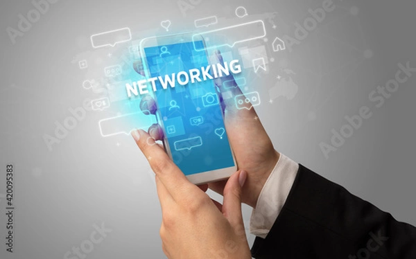 Fototapeta Hand using smartphone with social media concept