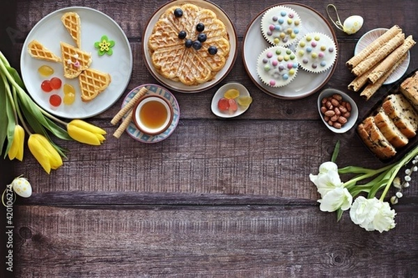 Fototapeta Flat layot from  festive dessert table with various of waffles, cake, muffins and sweets.