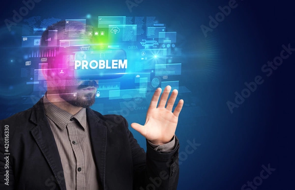 Fototapeta Businessman looking through Virtual Reality glasses