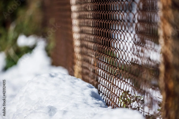 Obraz snow covered fence with wire
