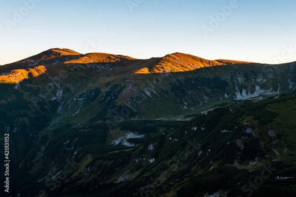 Obraz Mountain landscape with blue sky and sunbeams