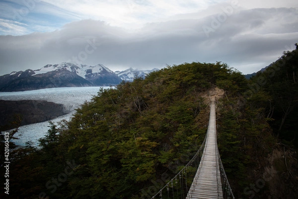 Obraz A bridge at the mountains, in front of a glaciar