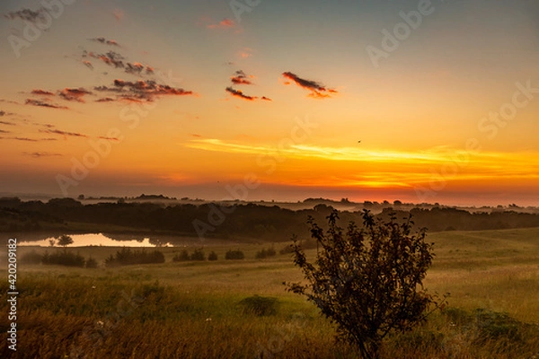 Obraz Rural landscape with clouds at sunset 