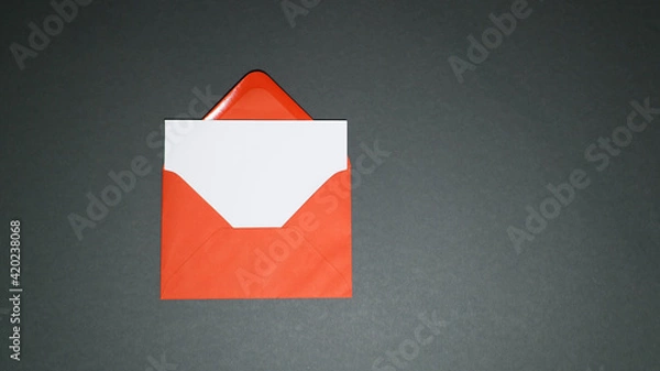 Obraz Blank greeting card with red envelope on dark background
