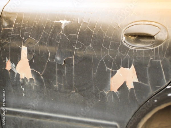 Obraz The car doors have an old paint and are on a black background.