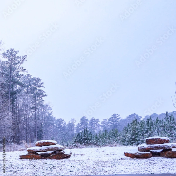 Obraz Snowy Landscape With Stacked Stone Display (Vertical)