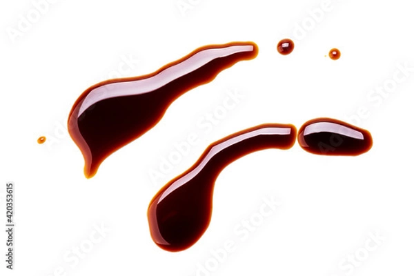 Fototapeta soy sauce drip isolated on a white background. soya sauce swirl cut out. above view. studio shot