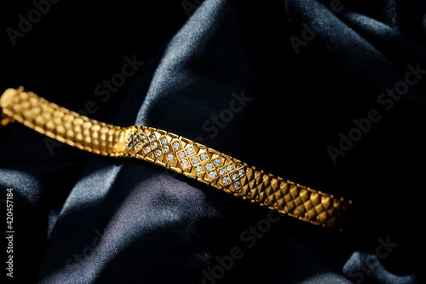 Obraz gold with diamond bracelet isolated on black background