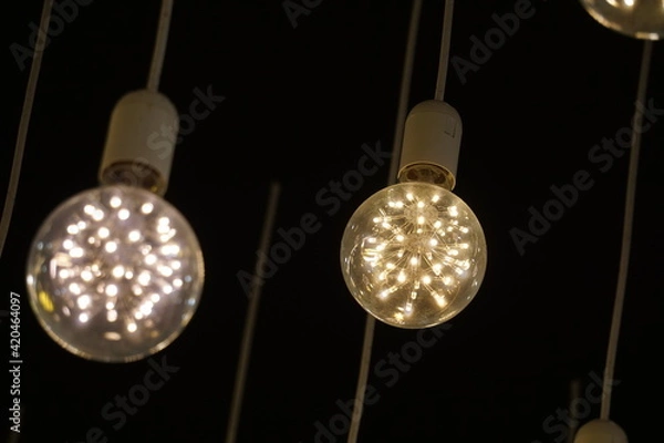 Obraz Beautiful Light bulbs in a row. Vintage light bulb Selective focus